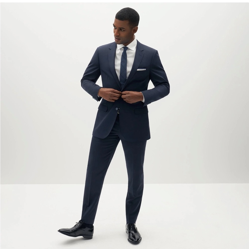 Never worn Navy Blue suit from Suit Shop.